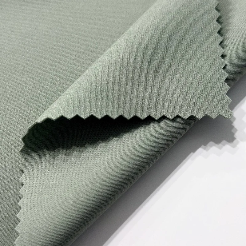 YA0443 supplied detail photograph showing the fine polyester face and reverse at a folded fabric edge