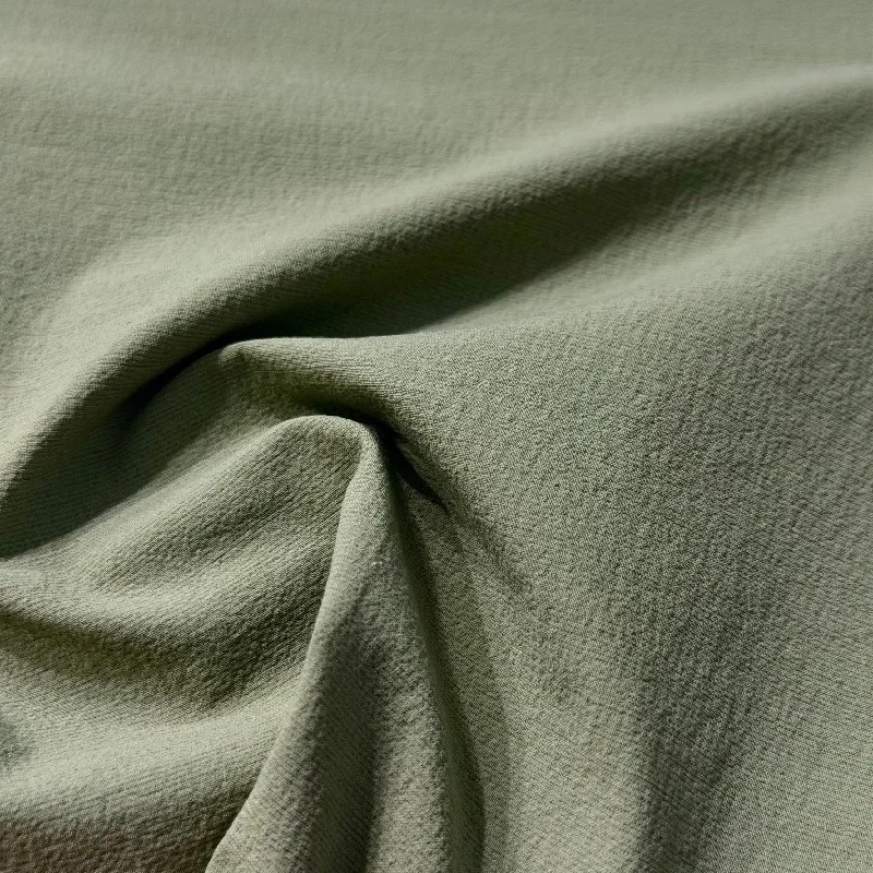 YA1609 supplied fabric detail photograph showing the Peach Dull surface and natural folds